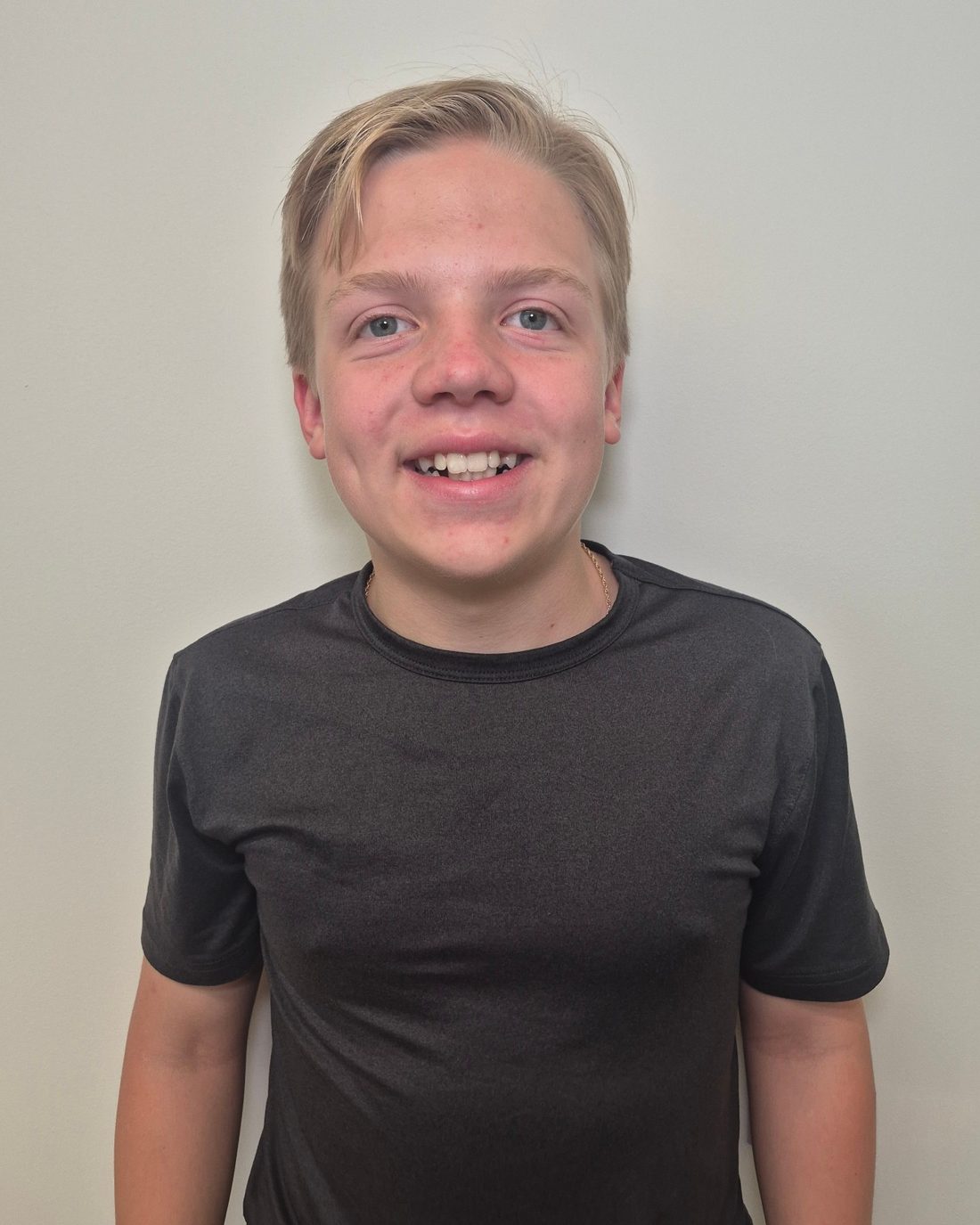 Henry Kennedy, smiling, in a dark T-shirt